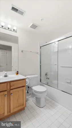 a bathroom with a sink toilet a mirror and shower