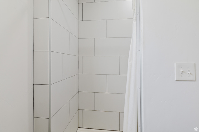 244 North 600 West Logan, UT 84321 - Photo 17 of 30 Shower enclosure featuring white subway tile with dark grout