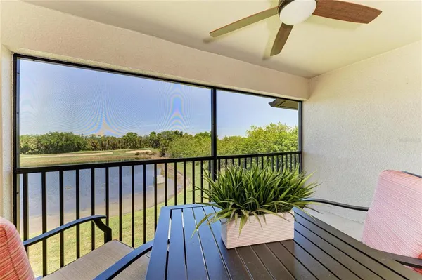 a view of a balcony with furniture