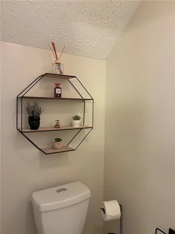 a bathroom with a toilet and a sink