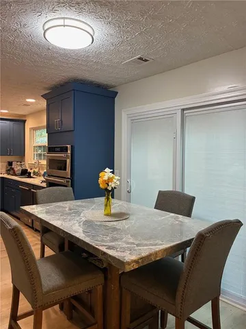 a view of a dining room with furniture