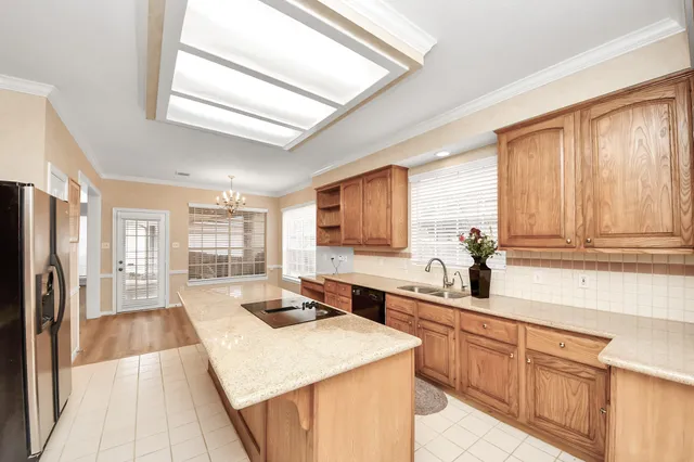 a kitchen with a sink stove and cabinets