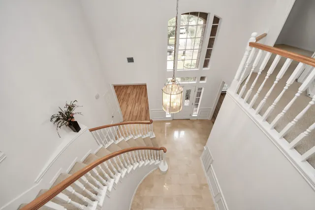 a view of an entryway with wooden floor