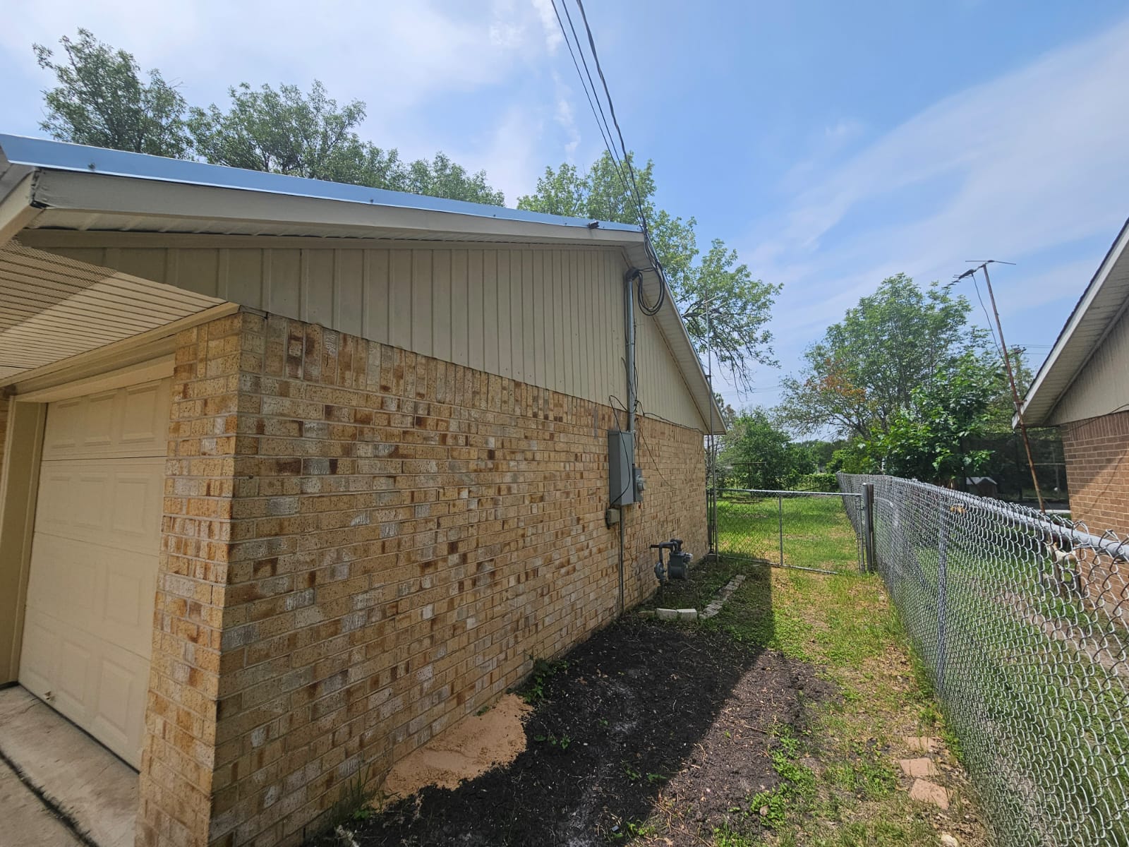 1401 Trinity Street Lockhart, TX 78644 - Photo 24 of 31 Exterior featuring brick siding and vertical vinyl siding