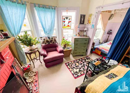 a living room with patio furniture and a window