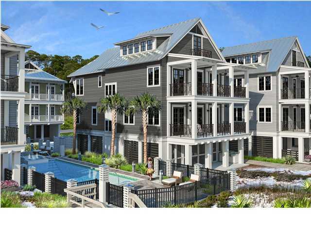 a front view of a residential apartment building with a yard
