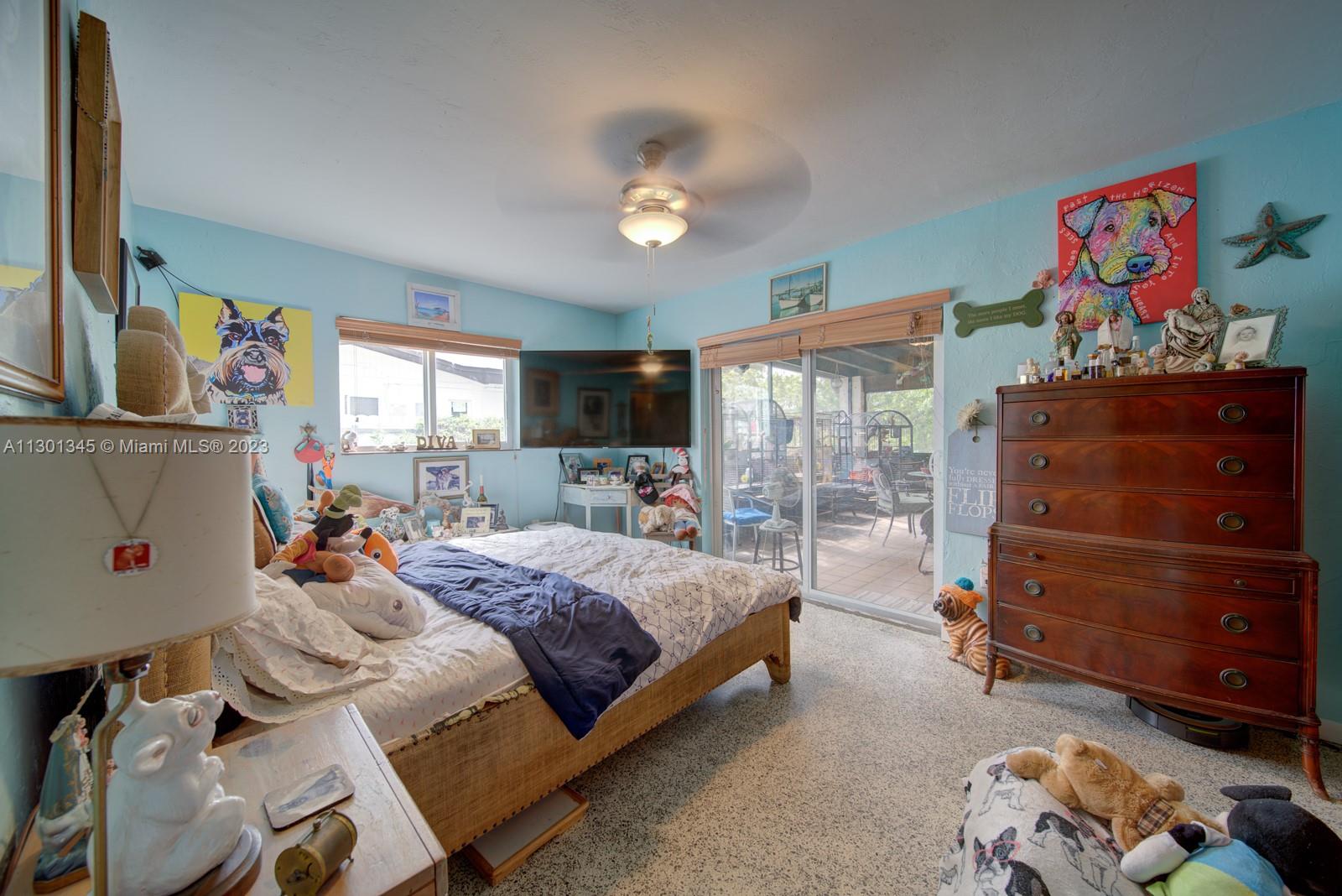 9520 April Road Cutler Bay, FL 33157 - Photo 14 of 26 a bed room with a bed and a tv