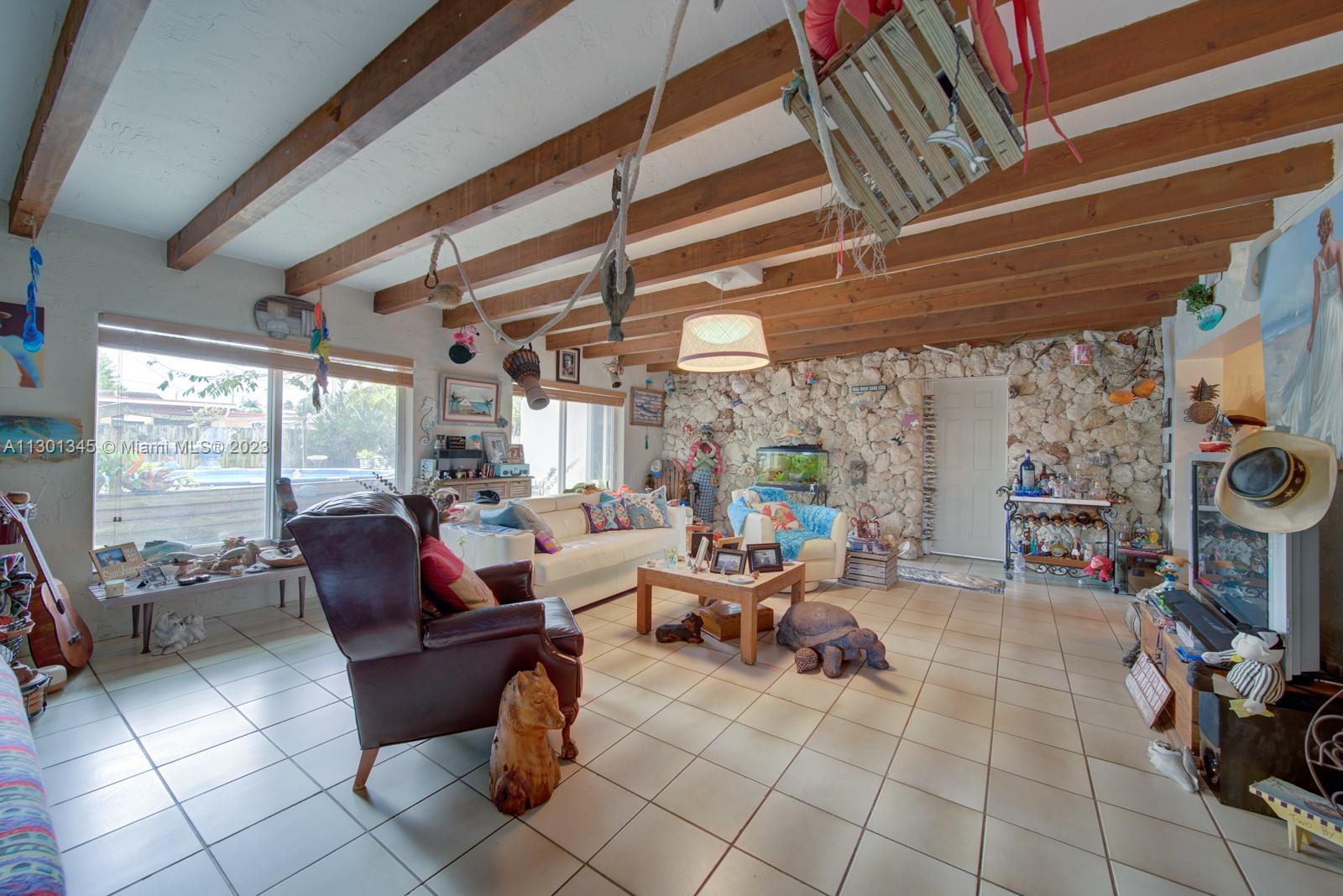 9520 April Road Cutler Bay, FL 33157 - Photo 20 of 26 a living room with fireplace furniture and a large window