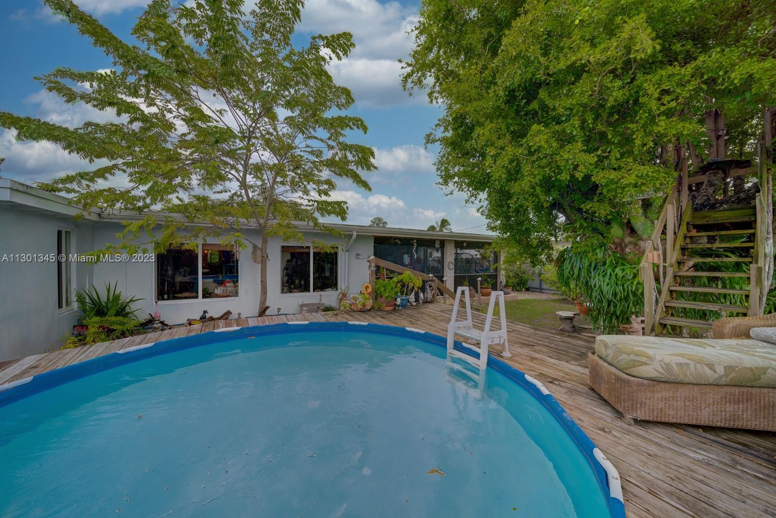 9520 April Road Cutler Bay, FL 33157 - Photo 5 of 26 a view of a house with backyard porch and sitting area
