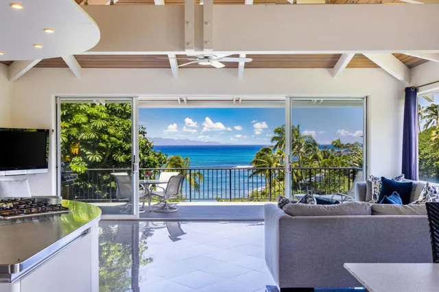 a living room filled with furniture and a flat screen tv