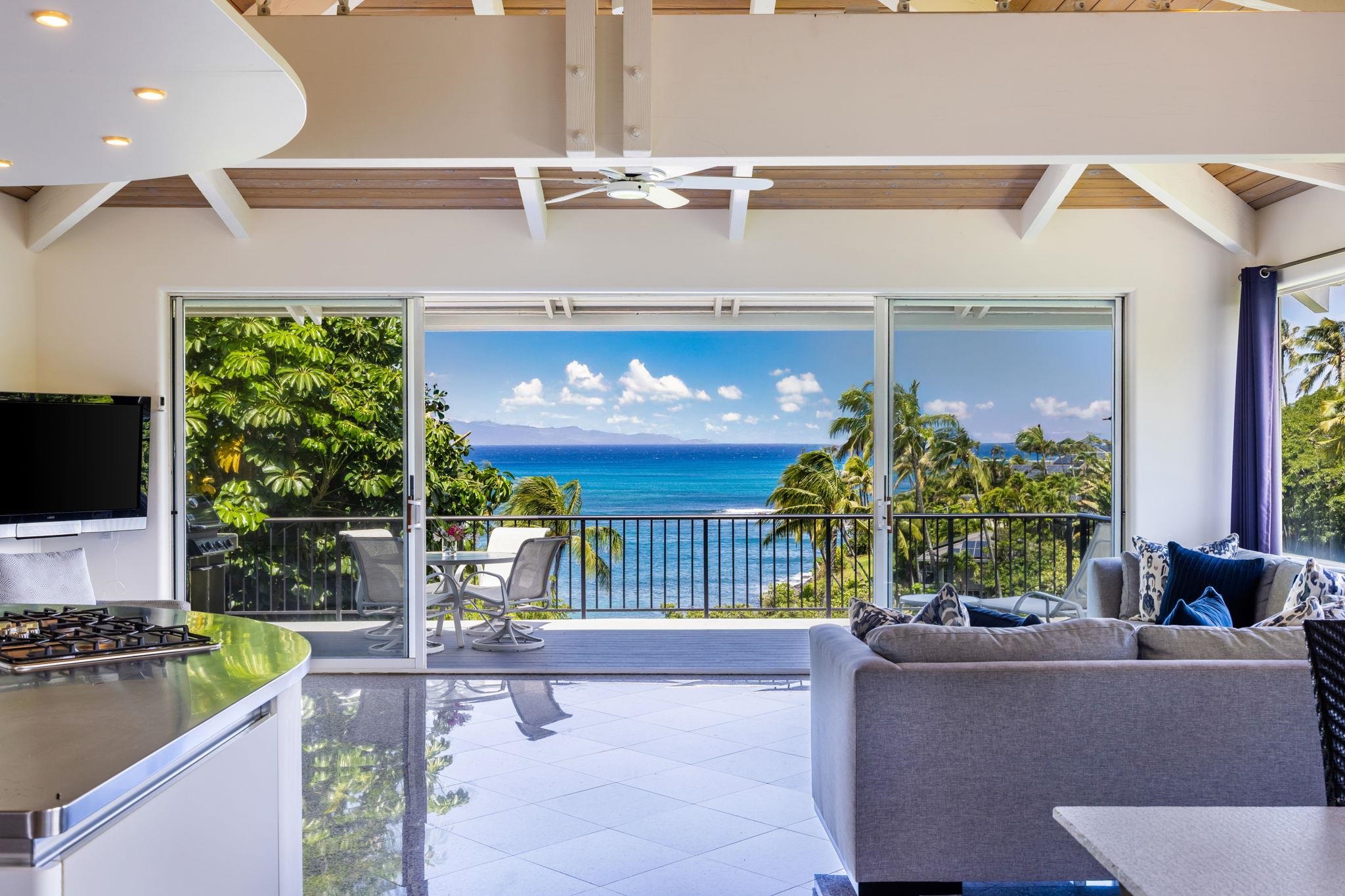 a living room filled with furniture and a flat screen tv