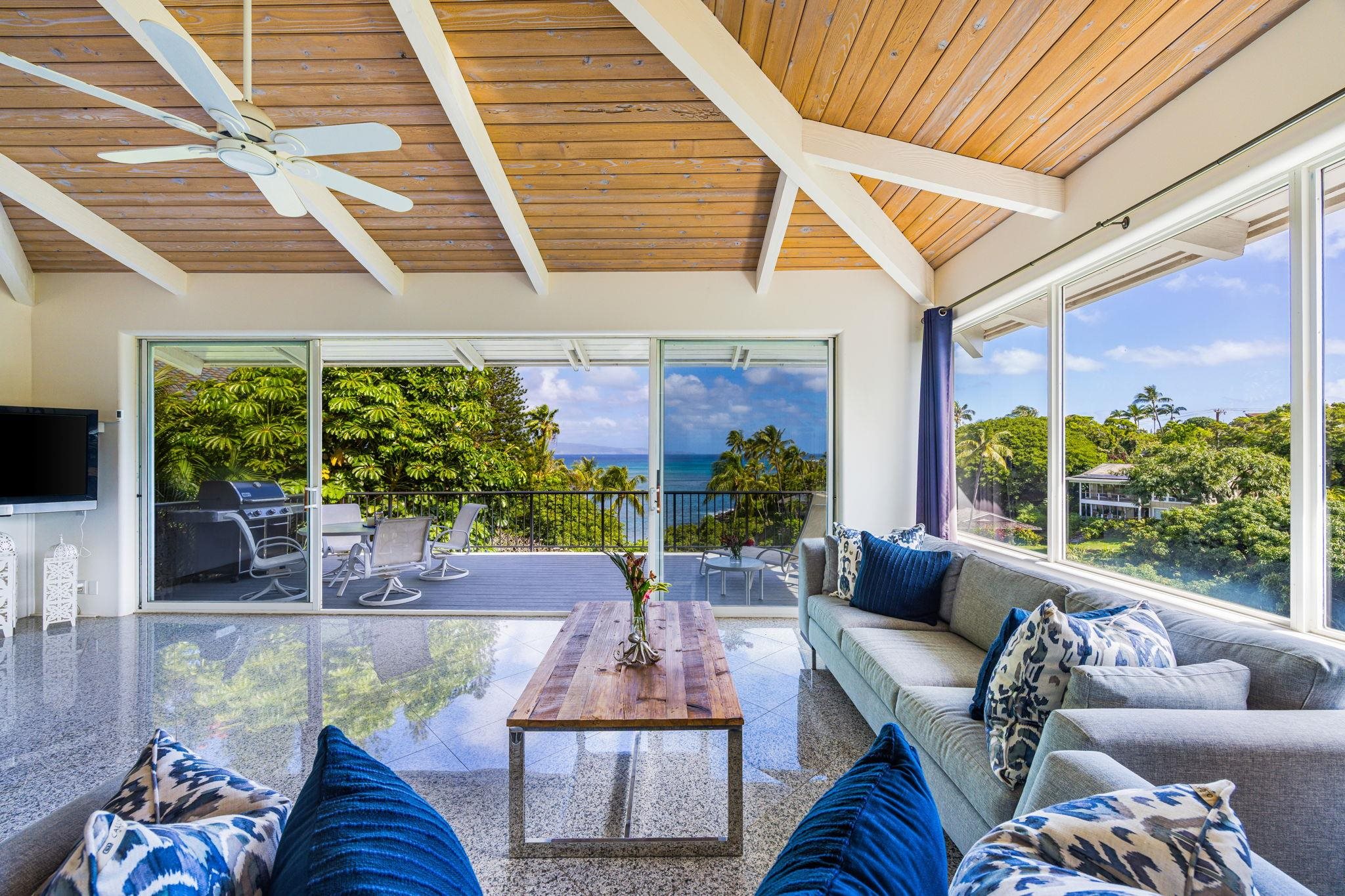 5045 Lower Honoapiilani Road, Unit 9 Lahaina, HI 96761 - Photo 12 of 50 a outdoor living space with furniture and garden view