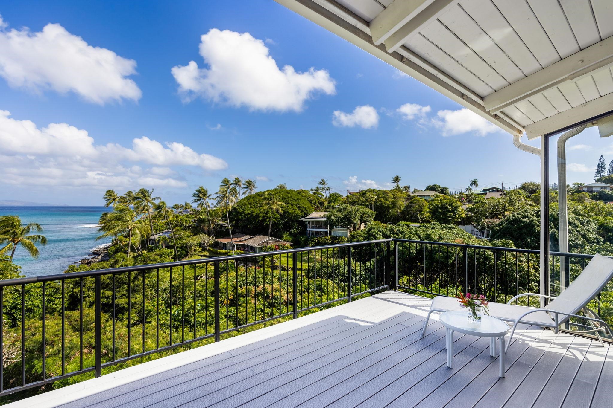 5045 Lower Honoapiilani Road, Unit 9 Lahaina, HI 96761 - Photo 16 of 50 a view of a balcony with wooden floor and city view