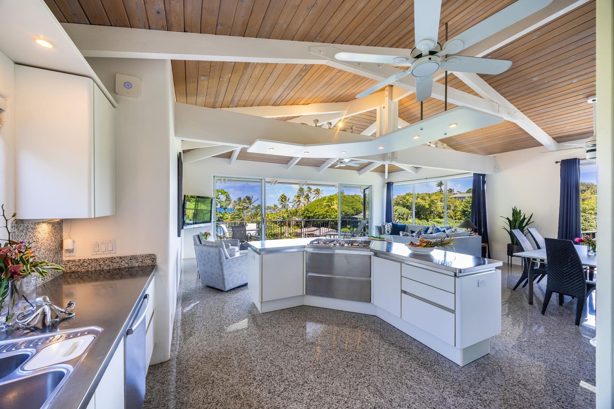 5045 Lower Honoapiilani Road, Unit 9 Lahaina, HI 96761 - Photo 19 of 50 a kitchen with a large counter top space and stainless steel appliances
