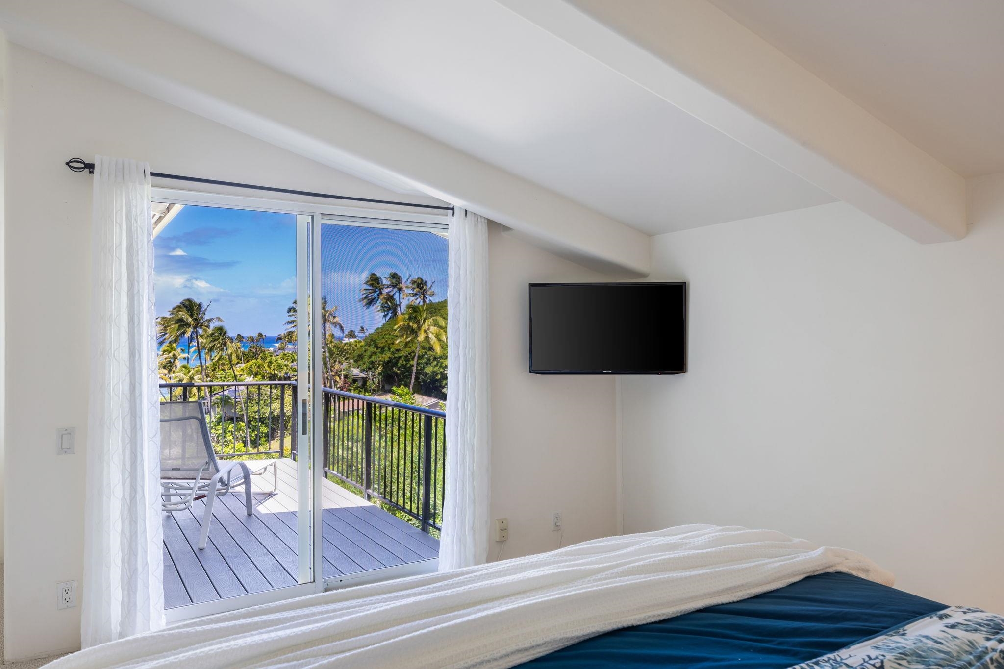 5045 Lower Honoapiilani Road, Unit 9 Lahaina, HI 96761 - Photo 28 of 50 a living room with furniture and a flat screen tv