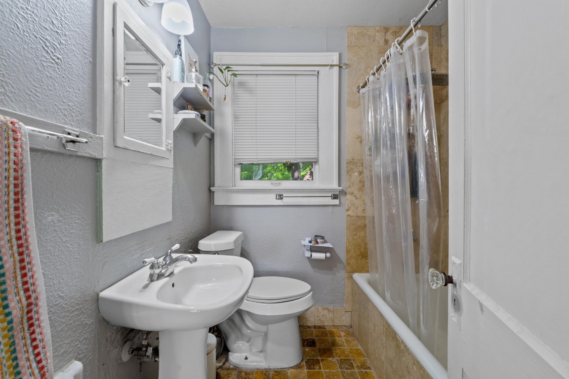 504 East 38th 1/2 Street Austin, TX 78751 - Photo 14 of 29 a bathroom with a sink toilet and shower