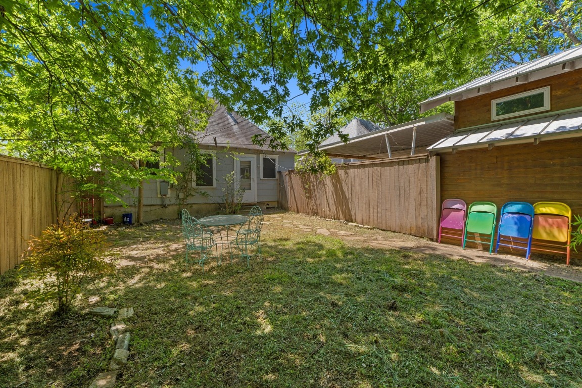 504 East 38th 1/2 Street Austin, TX 78751 - Photo 15 of 29 a backyard of a house with table and chairs