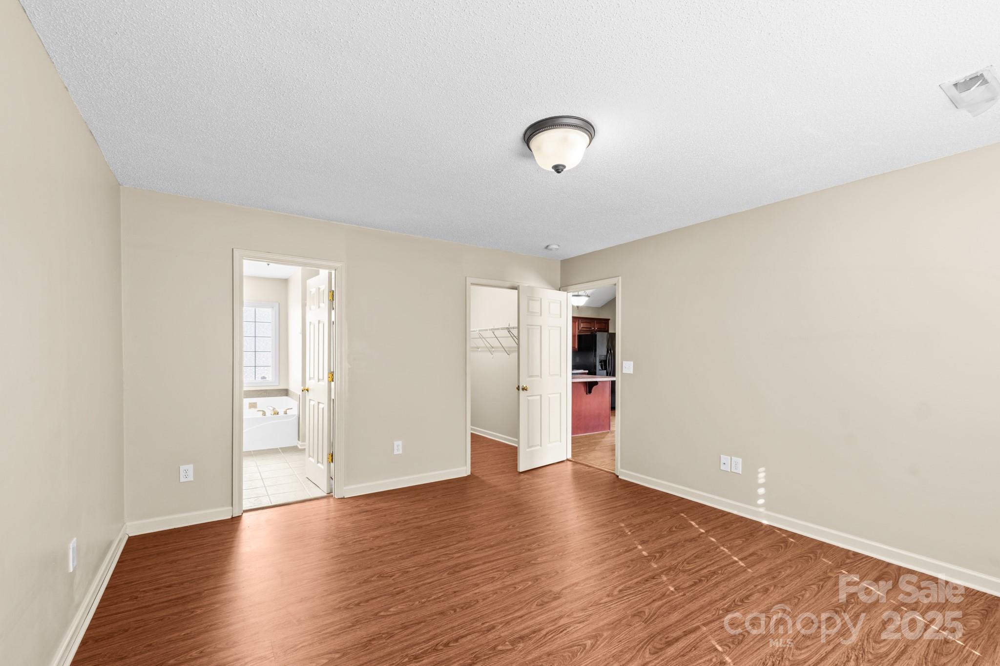 2244 Burris Road Conover, NC 28613 - Photo 12 of 38 an empty room with wooden floor and windows