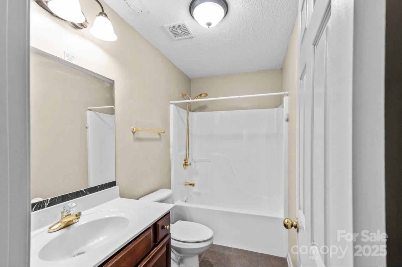 2244 Burris Road Conover, NC 28613 - Photo 22 of 38 a bathroom with a sink toilet and shower