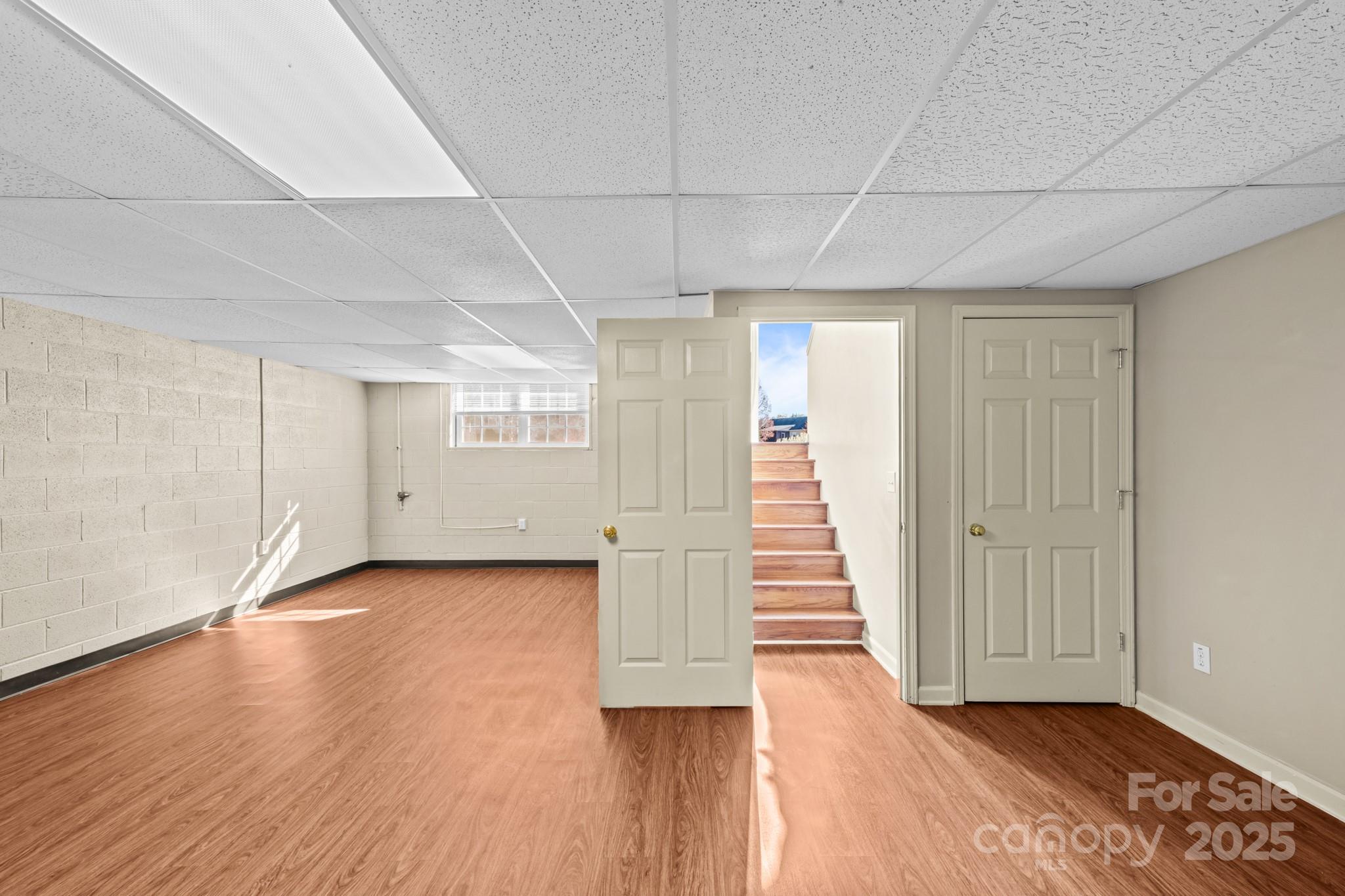 2244 Burris Road Conover, NC 28613 - Photo 24 of 38 an empty room with wooden floor and windows