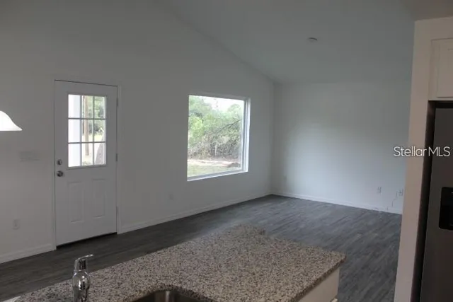 a view of an empty room and window