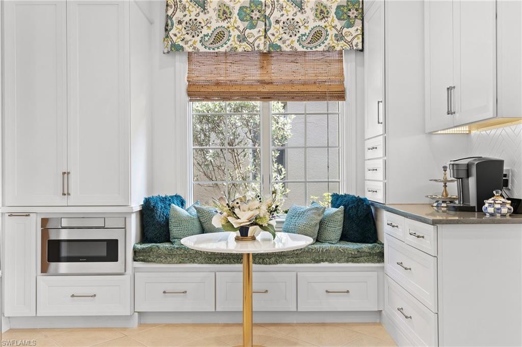 8536 Mallards Way Naples, FL 34114 - Photo 17 of 49 a kitchen with stainless steel appliances kitchen island granite countertop a cabinets and a stove