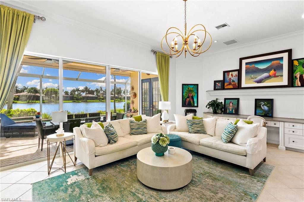8536 Mallards Way Naples, FL 34114 - Photo 2 of 49 a living room with furniture and a large window