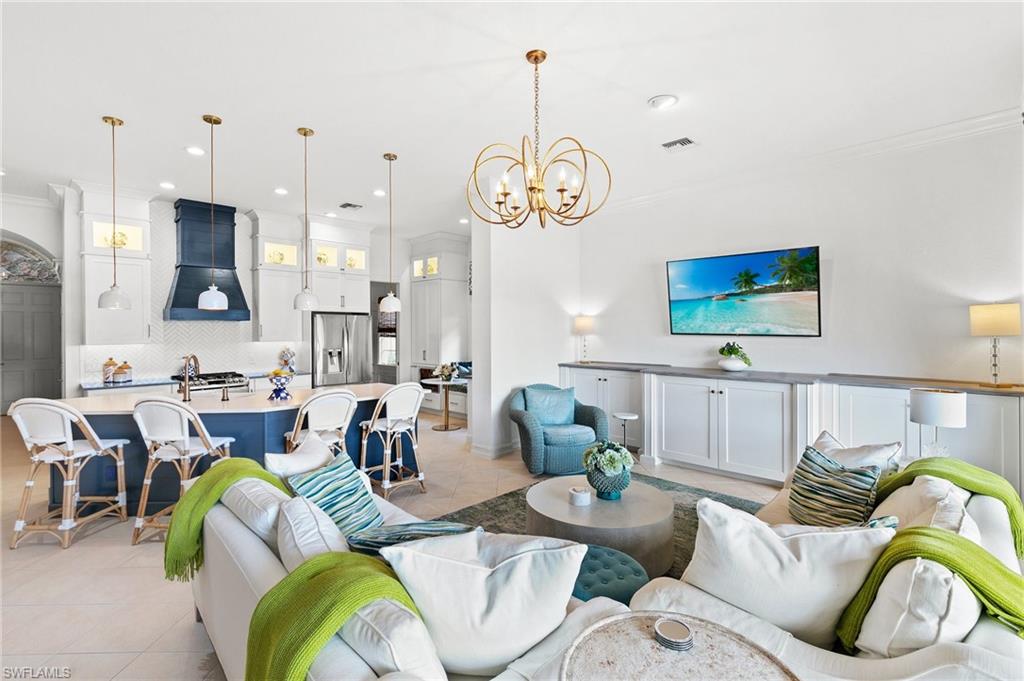 8536 Mallards Way Naples, FL 34114 - Photo 21 of 49 a living room with furniture kitchen view and a large window