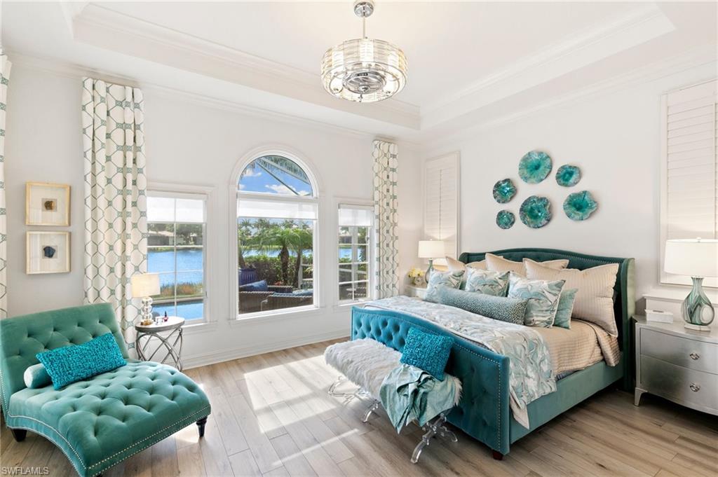 8536 Mallards Way Naples, FL 34114 - Photo 22 of 49 a bedroom with a bed and a couch