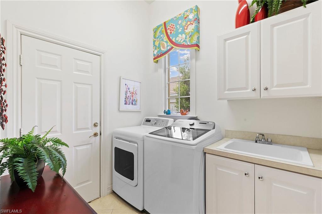 8536 Mallards Way Naples, FL 34114 - Photo 30 of 49 a utility room with dryer and washer