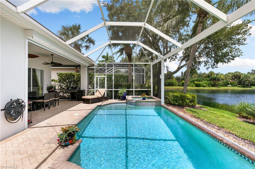 8536 Mallards Way Naples, FL 34114 - Photo 35 of 49 a view of a swimming pool with a patio and a yard