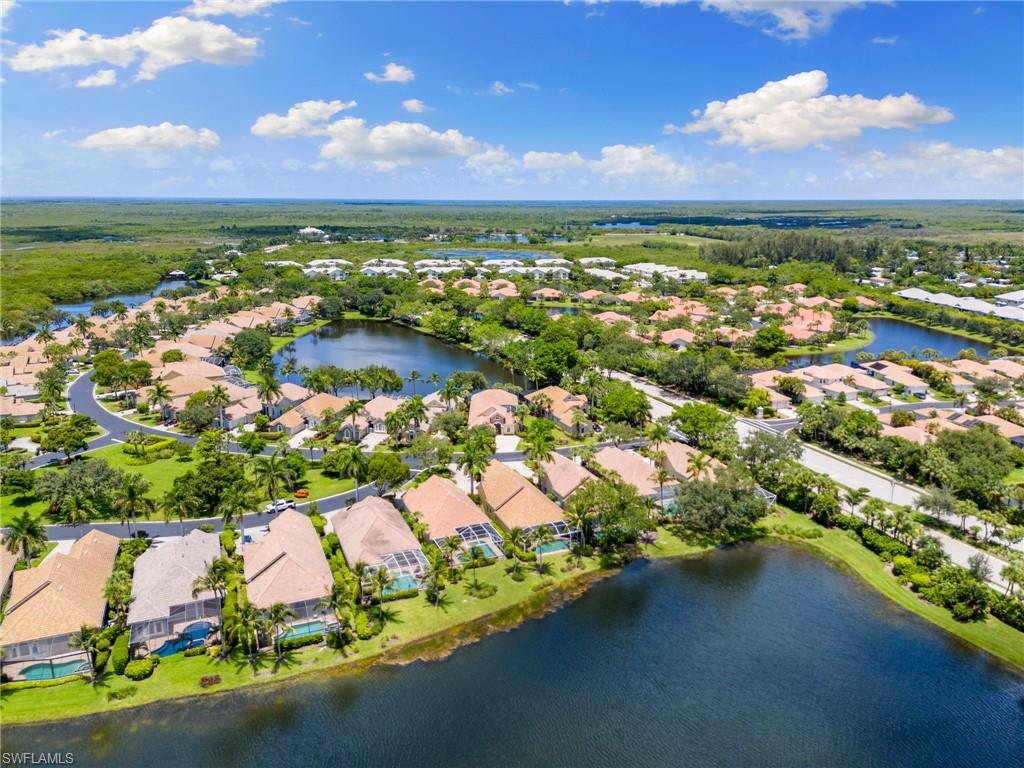 8536 Mallards Way Naples, FL 34114 - Photo 41 of 49 an aerial view of residential houses with outdoor space and lake view