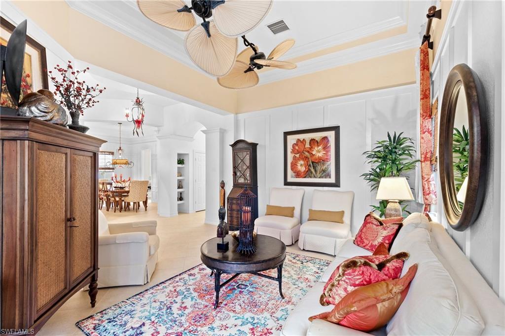 8536 Mallards Way Naples, FL 34114 - Photo 8 of 49 a living room with furniture and a flat screen tv