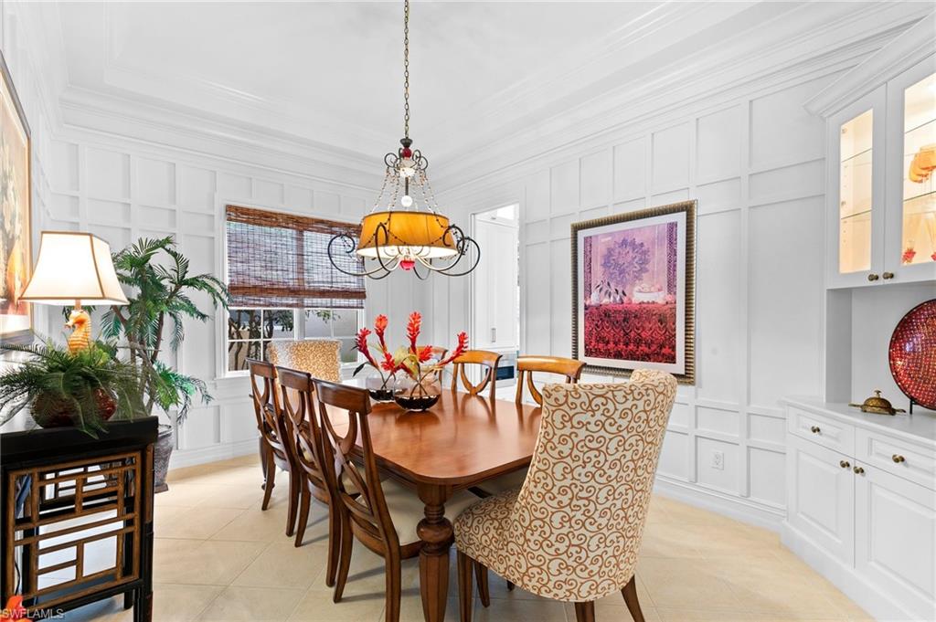 8536 Mallards Way Naples, FL 34114 - Photo 9 of 49 a dining room with furniture and window