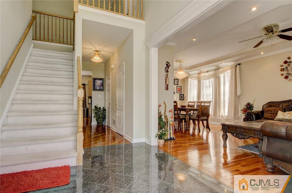20 Timber Ridge Road North Brunswick, NJ 08902 - Photo 3 of 24 a hallway with dining table and chairs