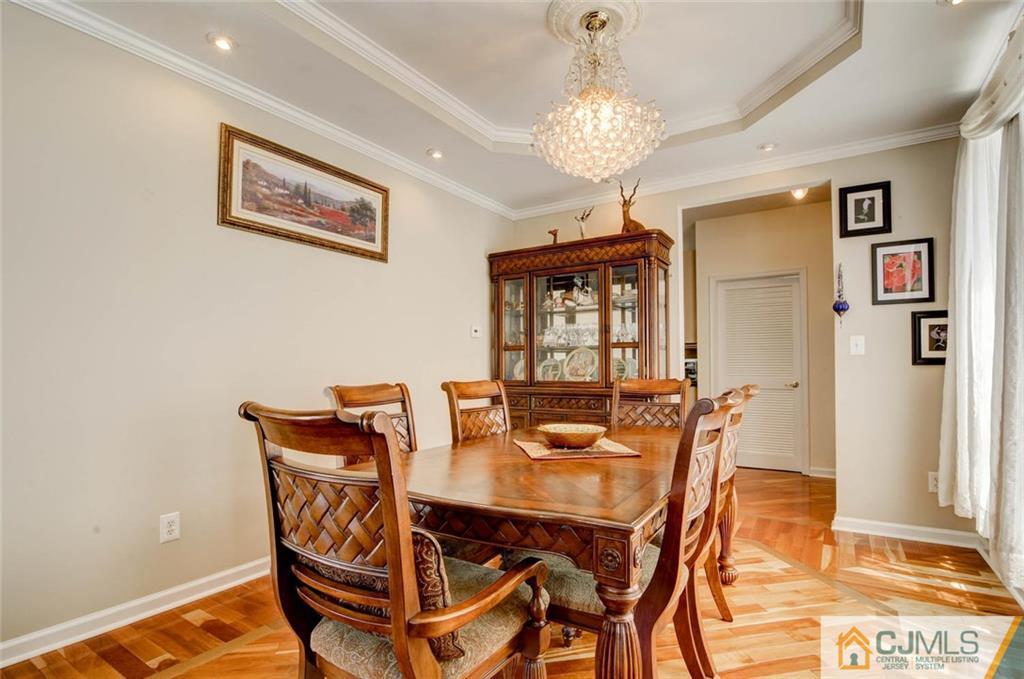20 Timber Ridge Road North Brunswick, NJ 08902 - Photo 8 of 24 a view of a dining room with furniture and chandelier