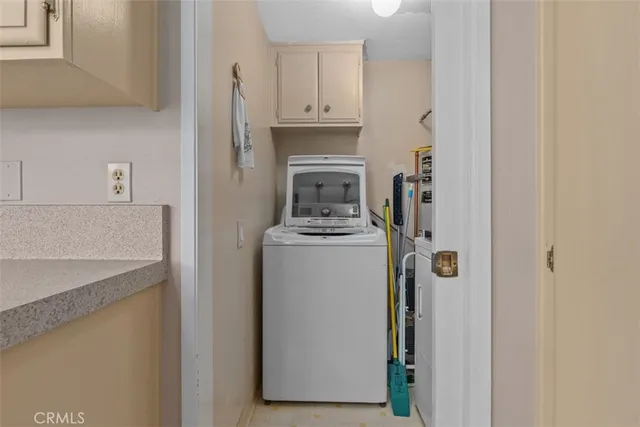 a view of a storage and utility room in a kitchen
