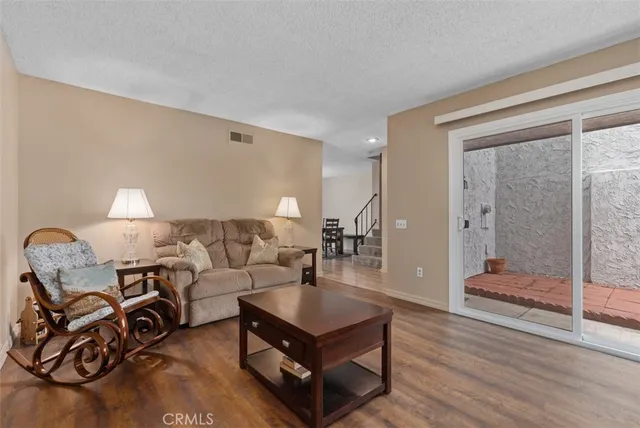 a living room with furniture and a table