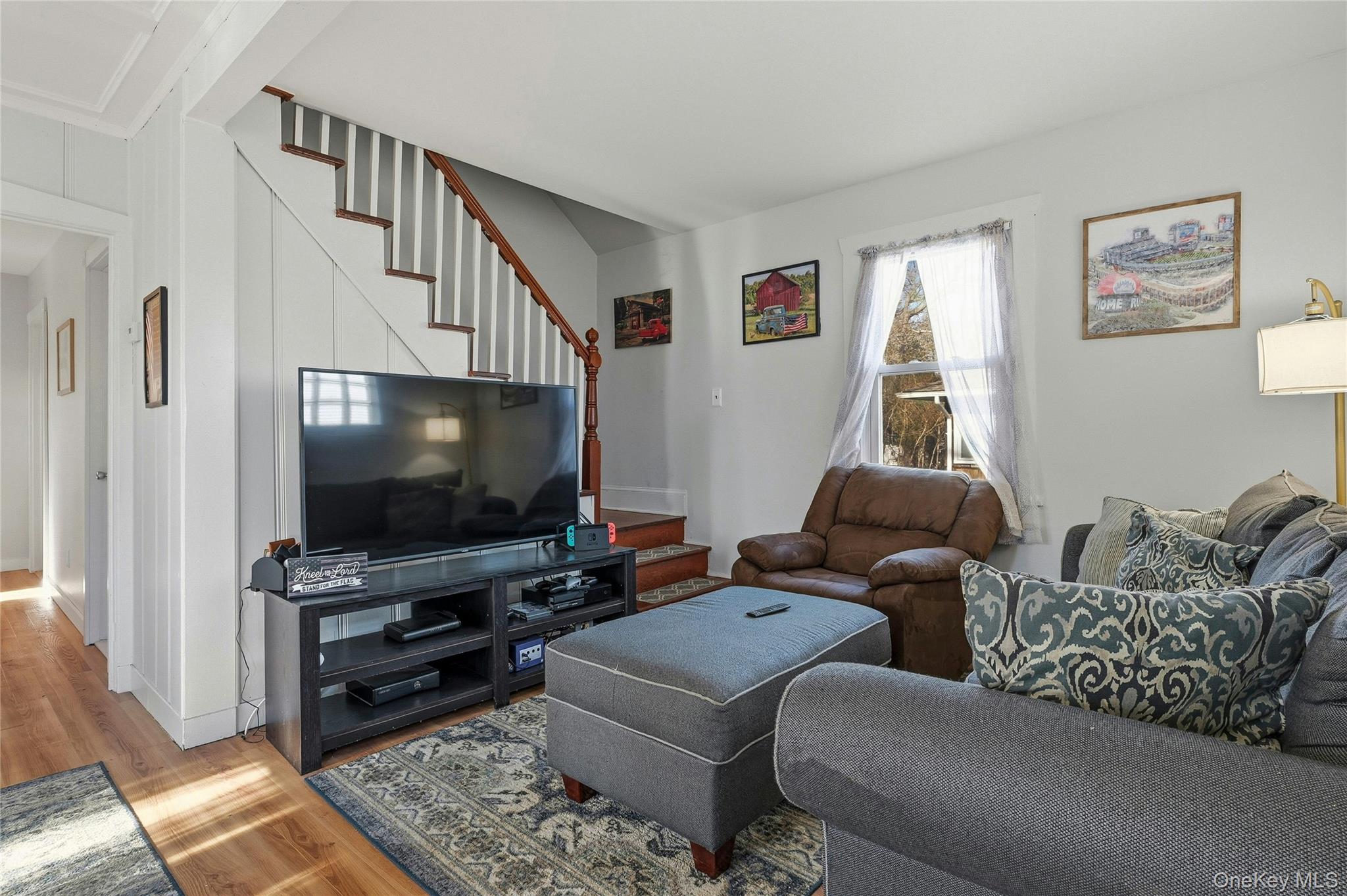 36 Columbine Road Rocky Point, NY 11778 - Photo 12 of 37 a living room with furniture and a flat screen tv