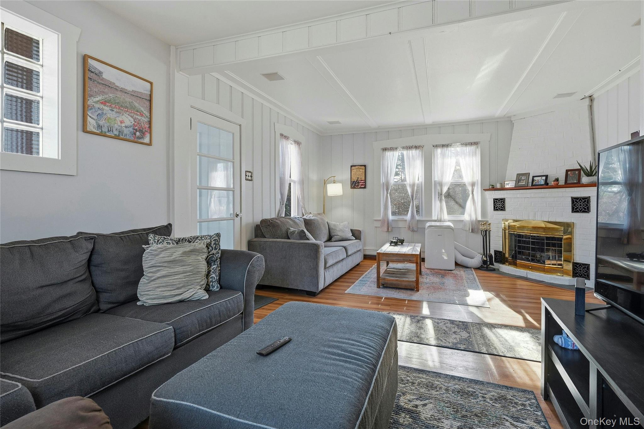 36 Columbine Road Rocky Point, NY 11778 - Photo 13 of 37 a living room with furniture a fireplace and a window