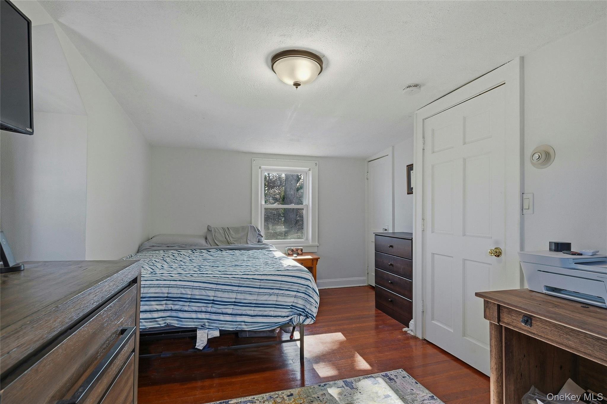 36 Columbine Road Rocky Point, NY 11778 - Photo 22 of 37 a bedroom with a bed and a dresser