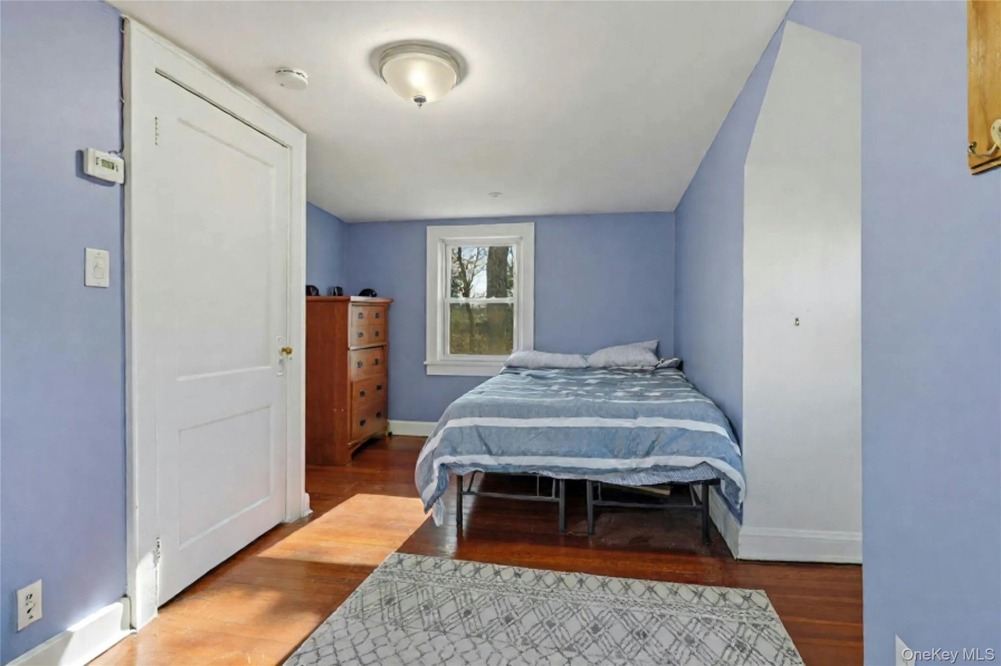 36 Columbine Road Rocky Point, NY 11778 - Photo 25 of 37 a bedroom with a bed and a rug