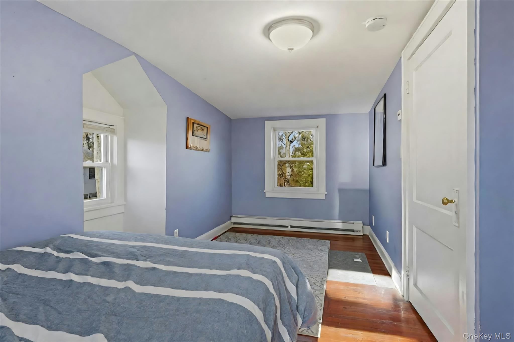 36 Columbine Road Rocky Point, NY 11778 - Photo 27 of 37 a bedroom with a bed and a window