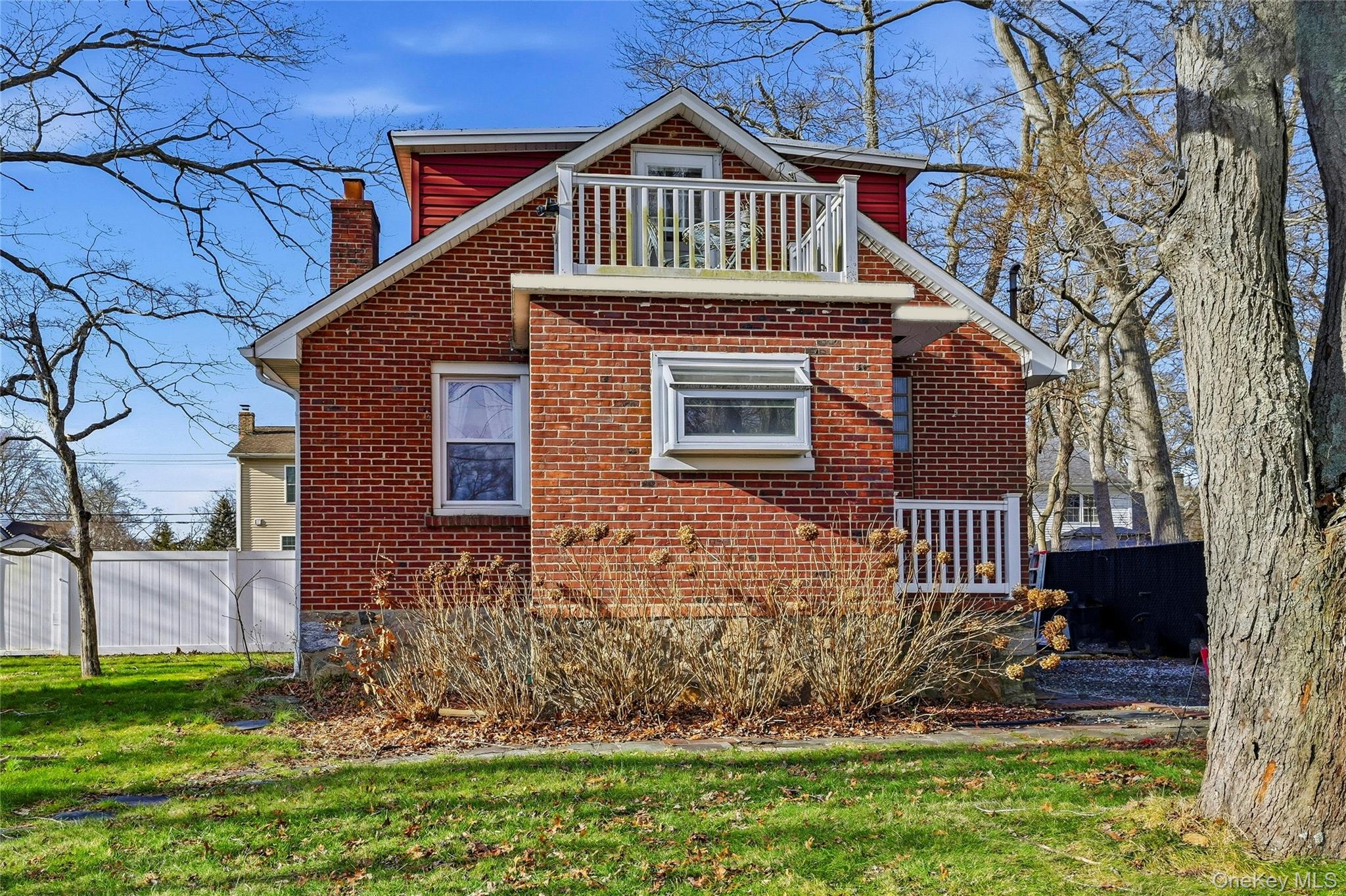 36 Columbine Road Rocky Point, NY 11778 - Photo 3 of 37 a front view of a house with a garden