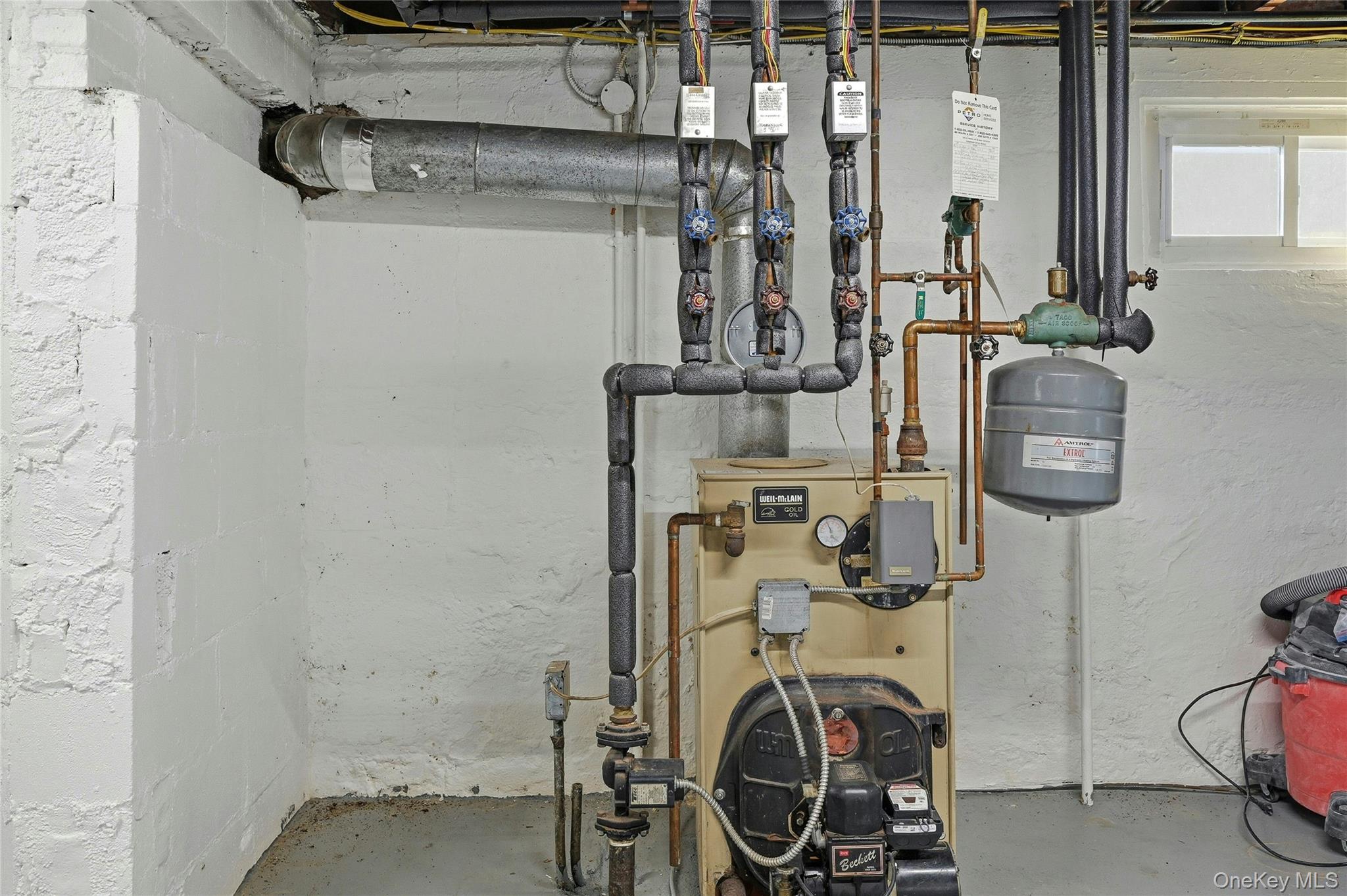 36 Columbine Road Rocky Point, NY 11778 - Photo 31 of 37 a view of storage and utility room with racks on the wall