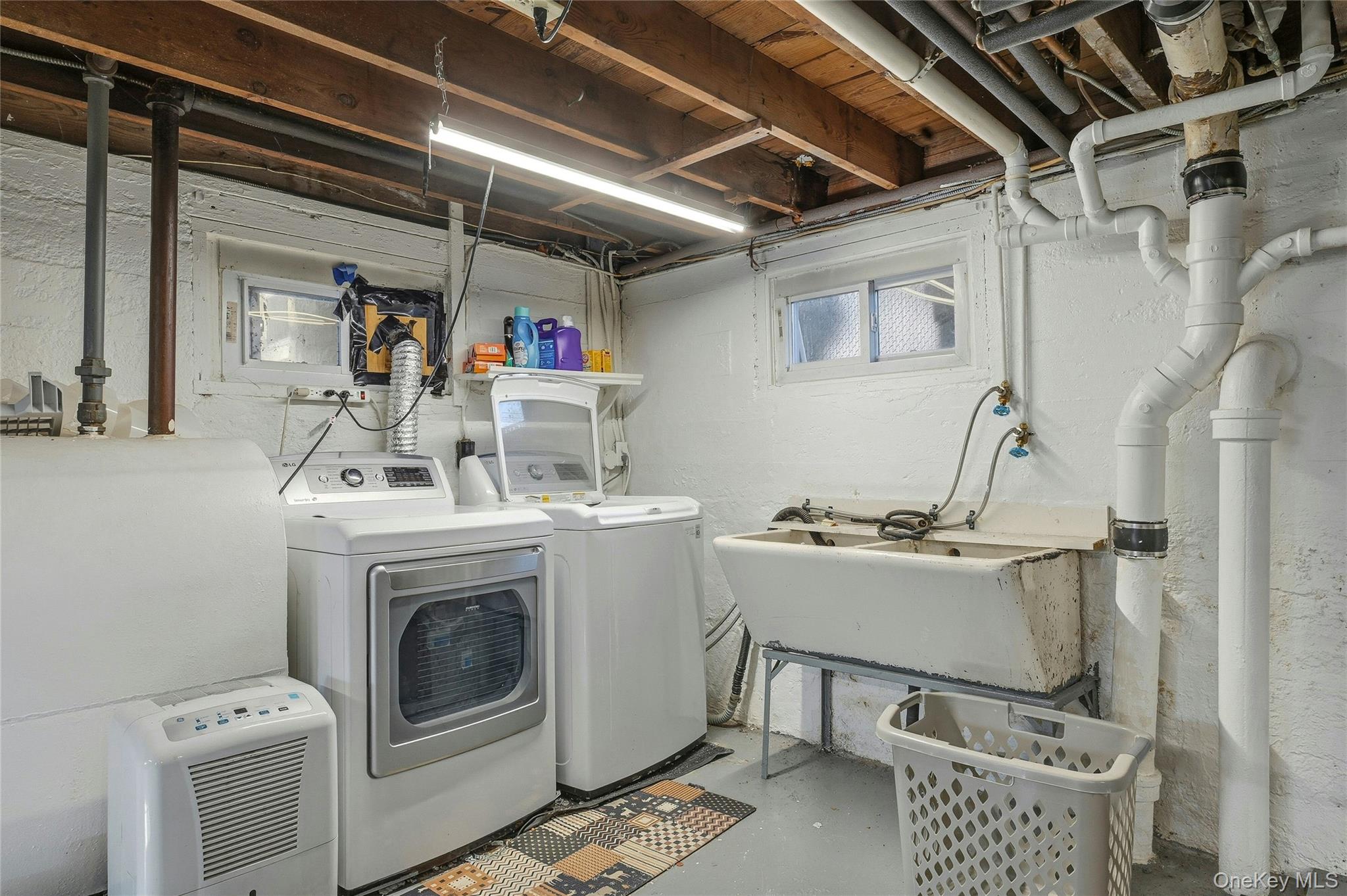 36 Columbine Road Rocky Point, NY 11778 - Photo 33 of 37 a utility room with dryer and washer