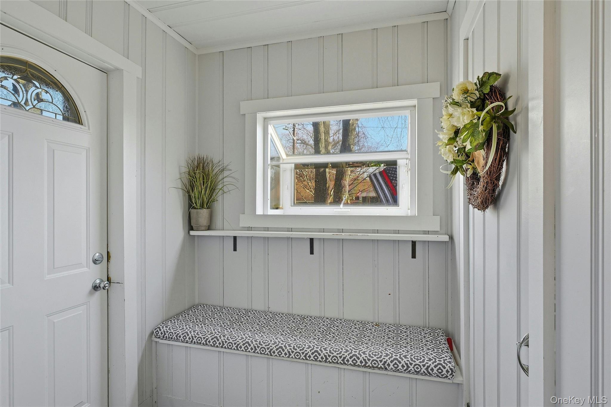36 Columbine Road Rocky Point, NY 11778 - Photo 9 of 37 a view of an entryway with a window