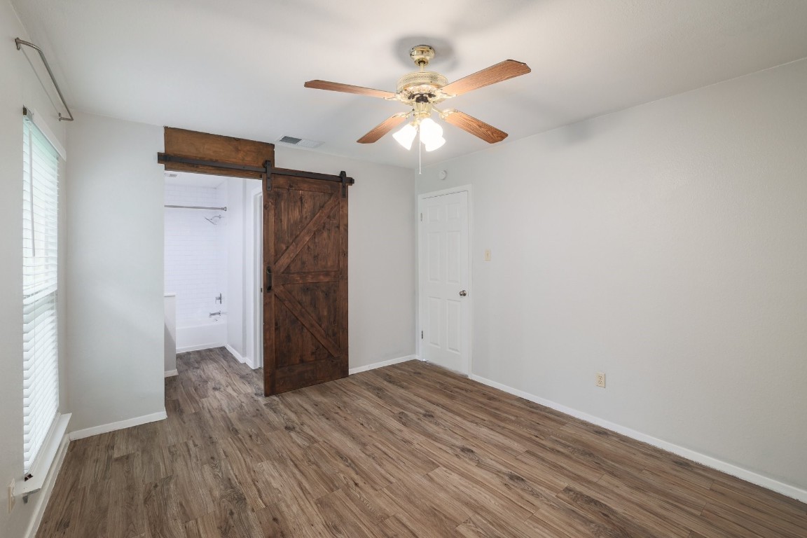 10616 Mellow Meadow Drive, Unit 46A Austin, TX 78750 - Photo 10 of 23 Primary bedroom looking into the bathroom.