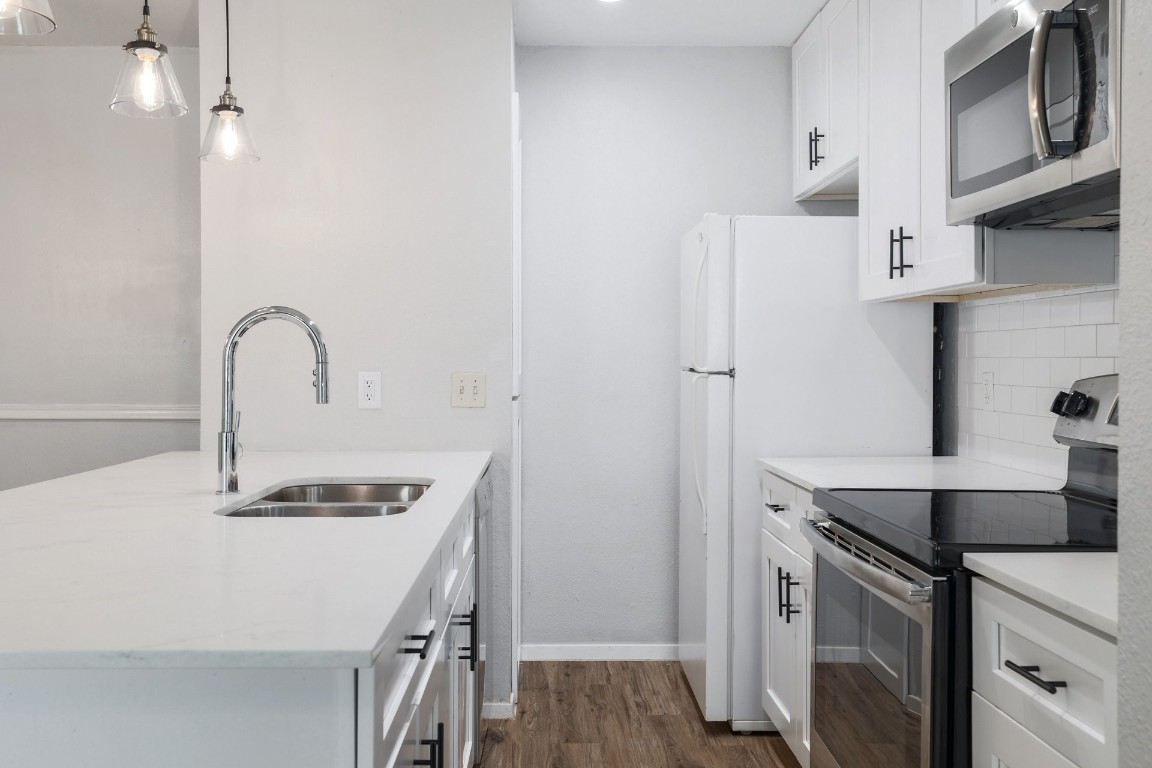 10616 Mellow Meadow Drive, Unit 46A Austin, TX 78750 - Photo 7 of 23 Updated kitchen includes quartz countertops