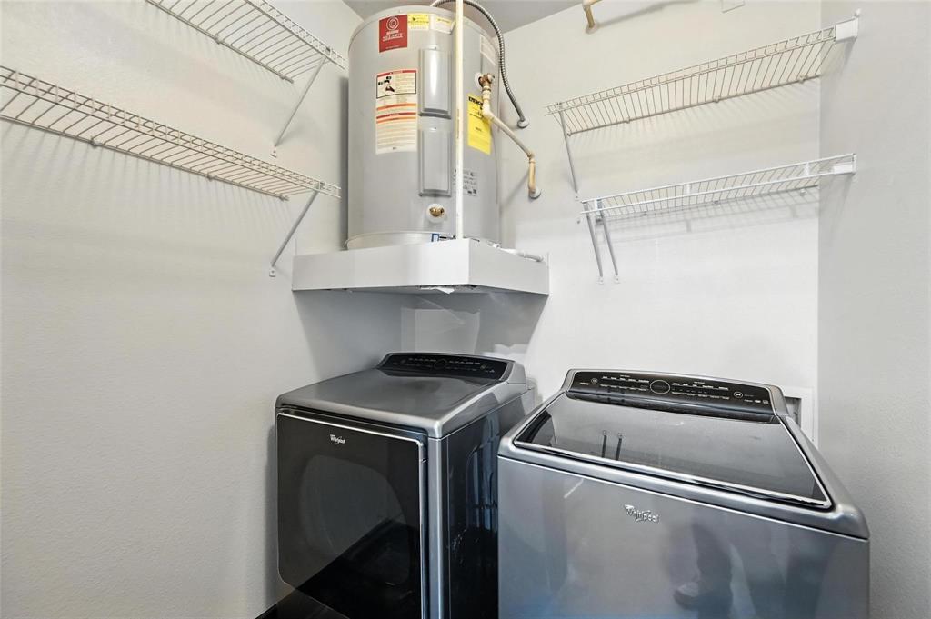 4414 Cedar Springs Road, Unit 124 Dallas, TX 75219 - Photo 15 of 20 a utility room with dryer and washer